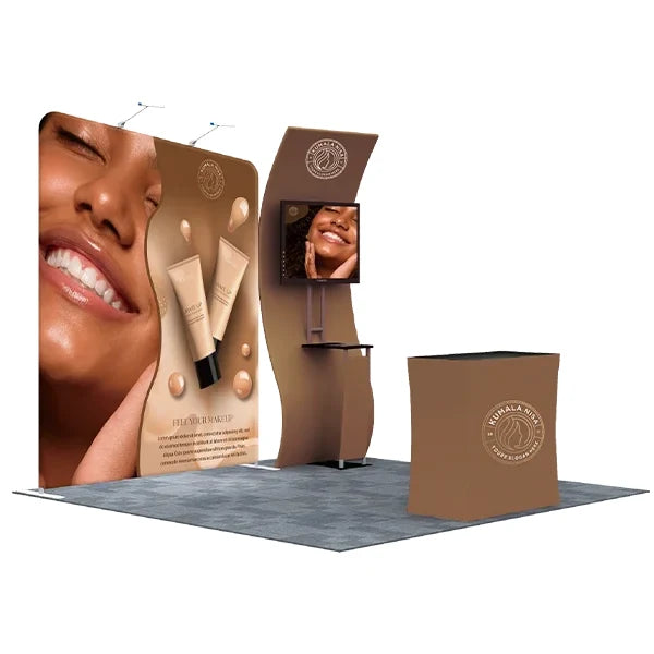 10 × 10 indoor booth example with a printed backdrop, display screen and front counter