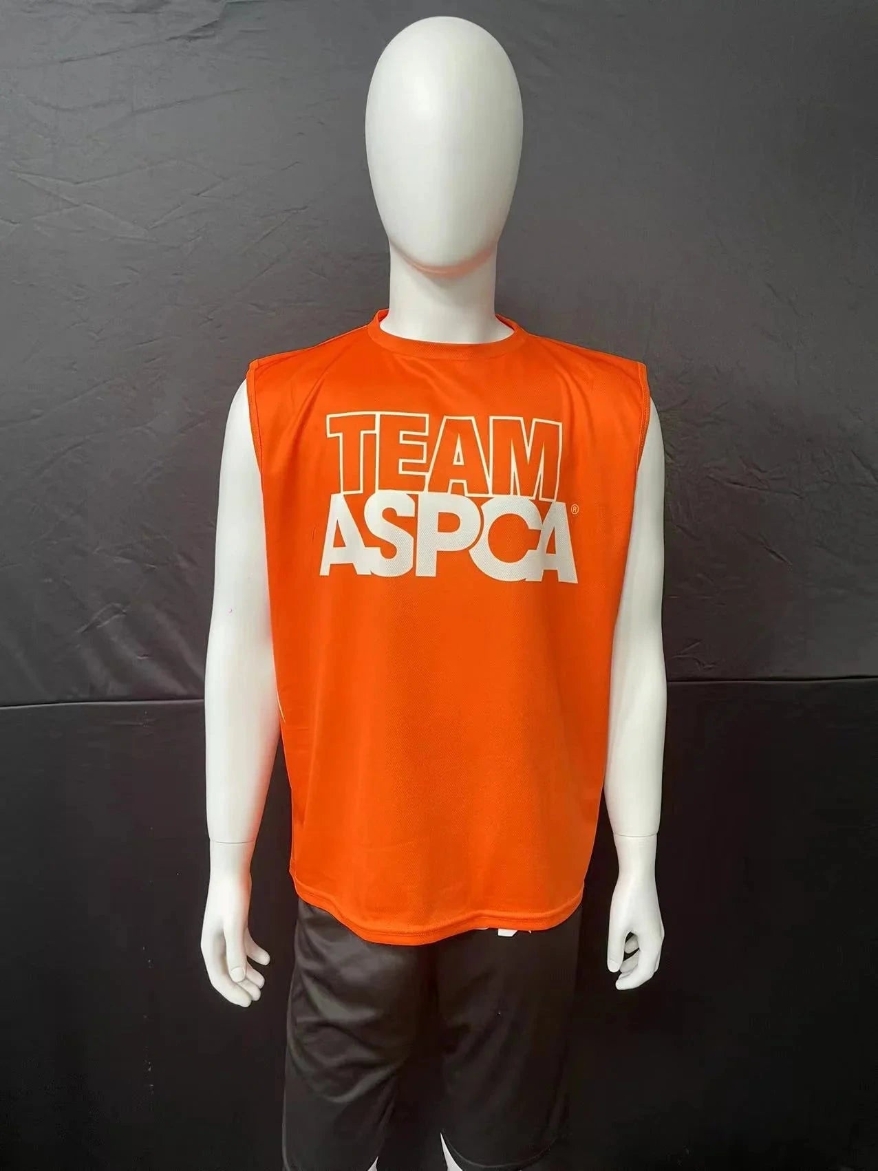 Orange sleeveless crew-neck jersey with sample organization artwork